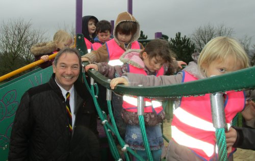 Children on rope bridge with Councillor
