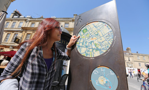 person pointing at map of bath