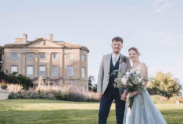 American Museum building with newly wedded couple
