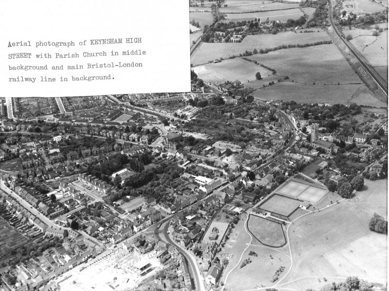 Aerial view Keynsham Highstreet with parish church and bristol-london railway