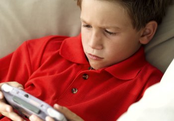 Boy with handheld Computer Game
