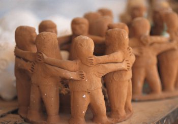 clay model of people hugging each other 