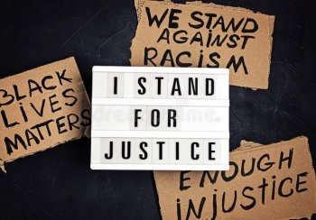 Anti racism banners saying I Stand For Justice and Black Lives Matter