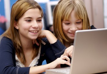 two girls and a lap top computer