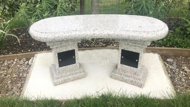 Curved granite bench close up view