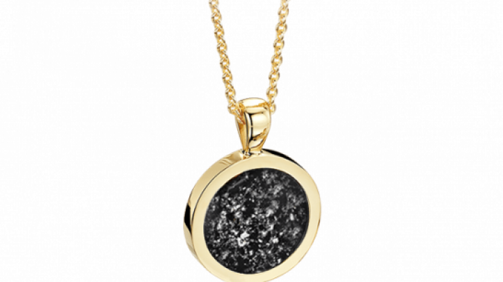 gold and black round pendant