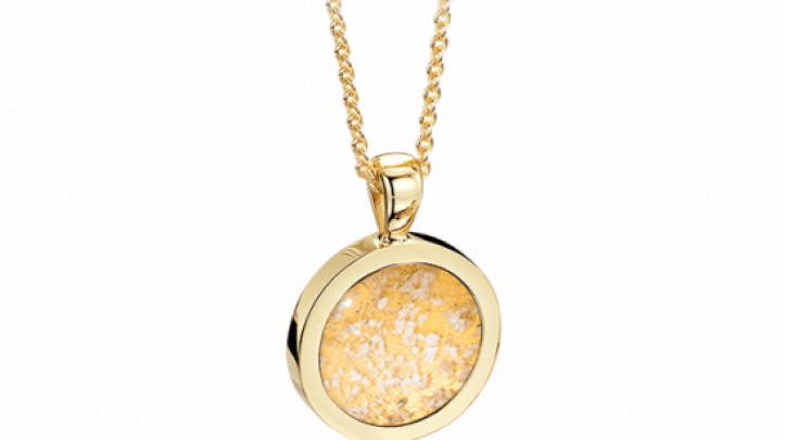 gold and clear round pendant