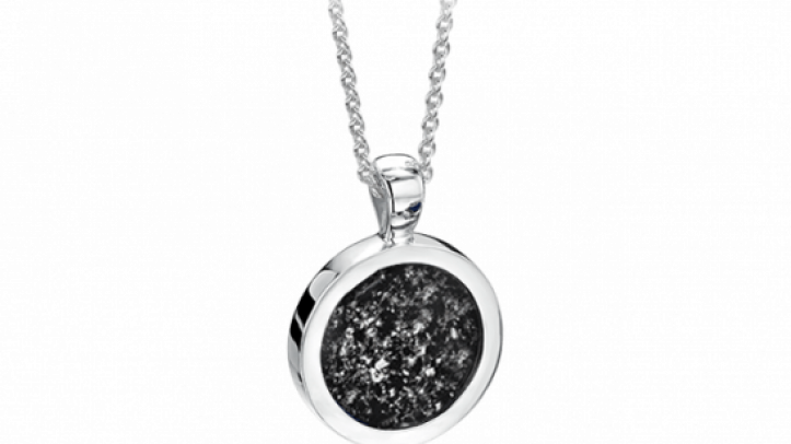 silver and black round pendant