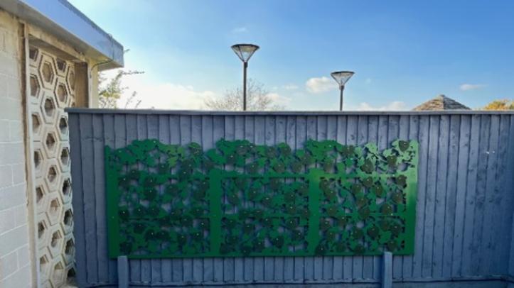 fence with leaves memorial attached
